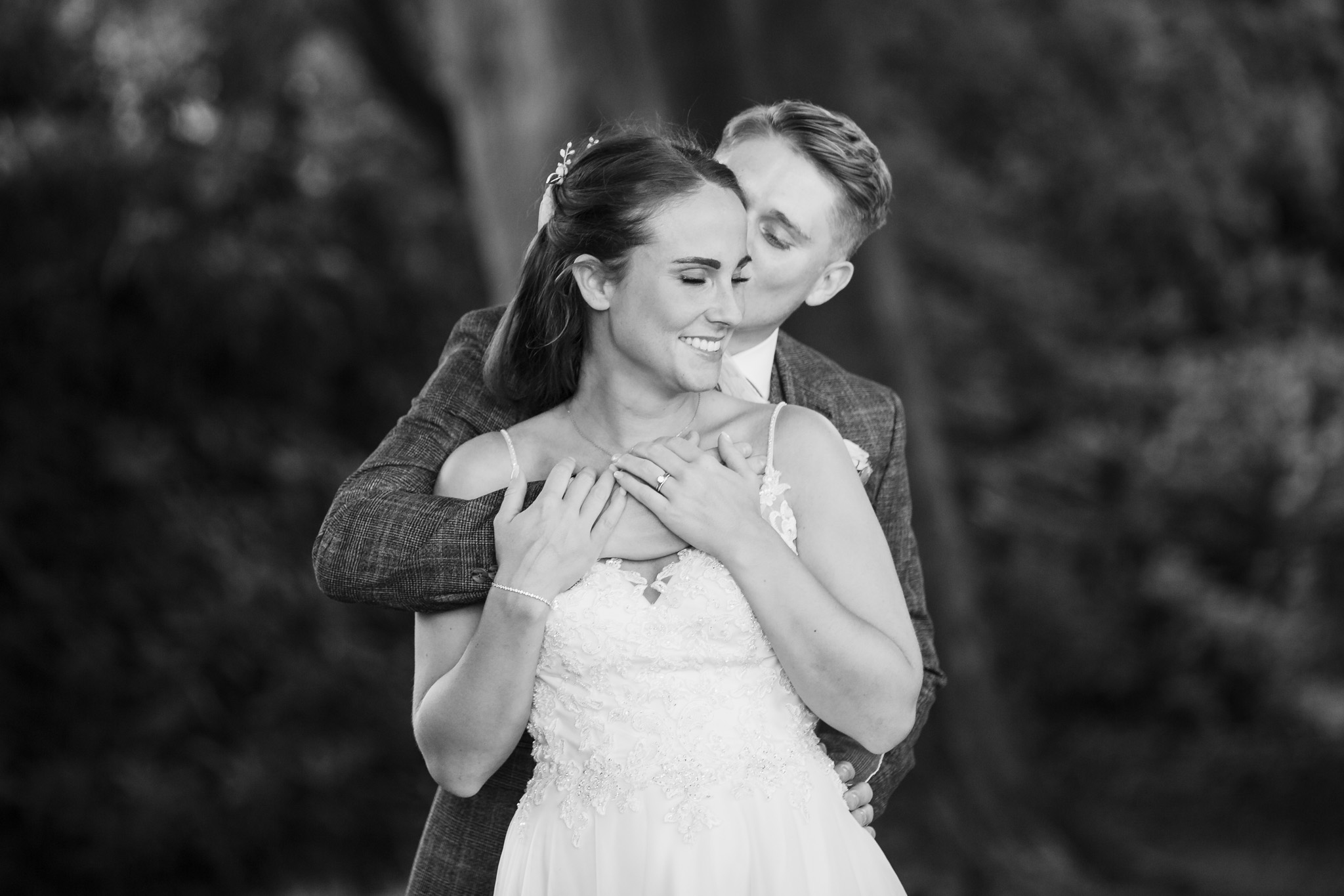 Bride and Groom cuddle at night at Rudding Park