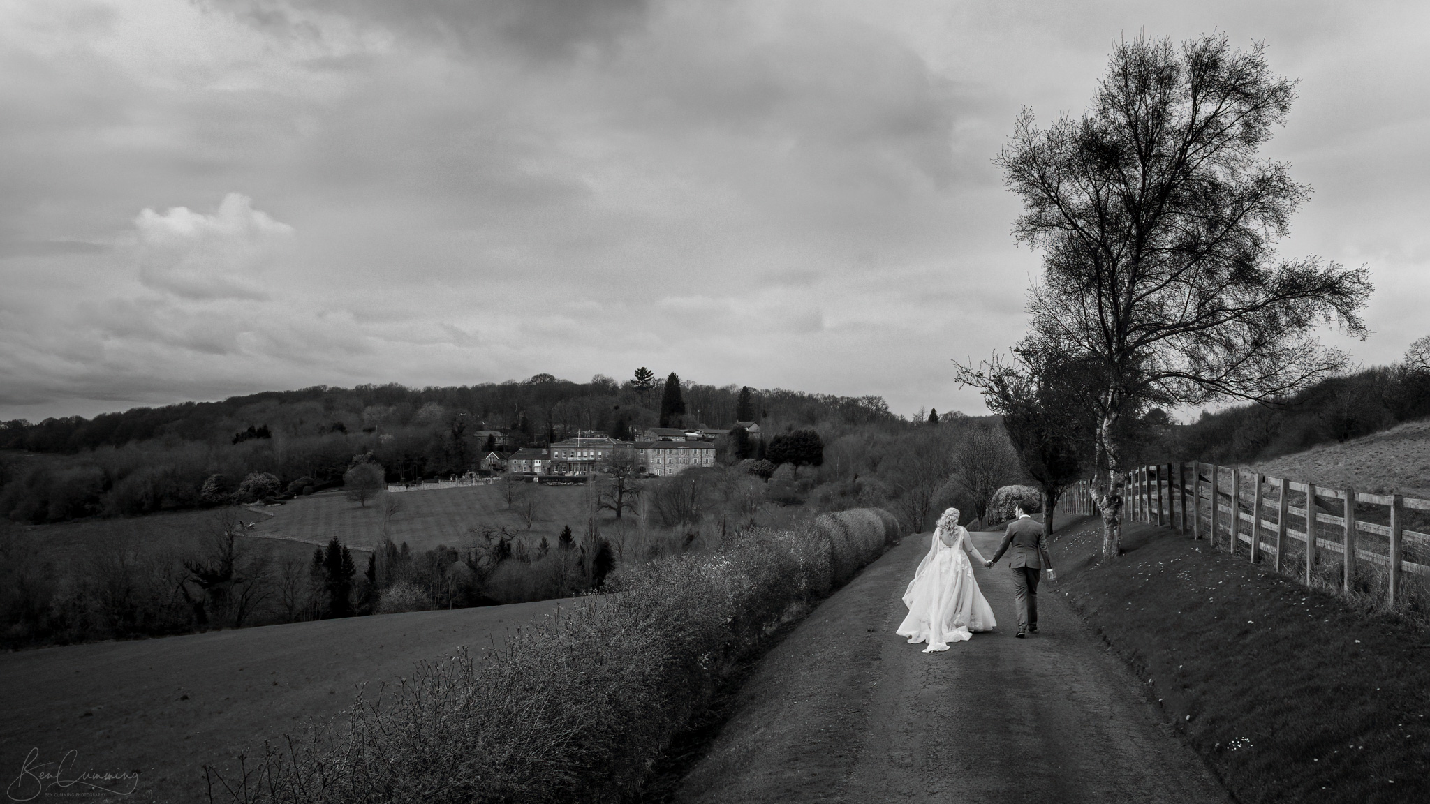 Bride and Groom Walking down the lane towards their Wedding Venue
